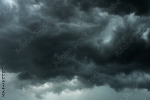 Weather in summer with black cloud and storm, Dark sky and dramatic storm clouds before rainy, Bad weather with precipitation in rainy season