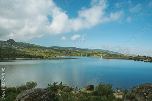 Blue water at the Rossim Lake with dam
