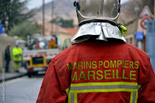 Fireman helmeted in a street