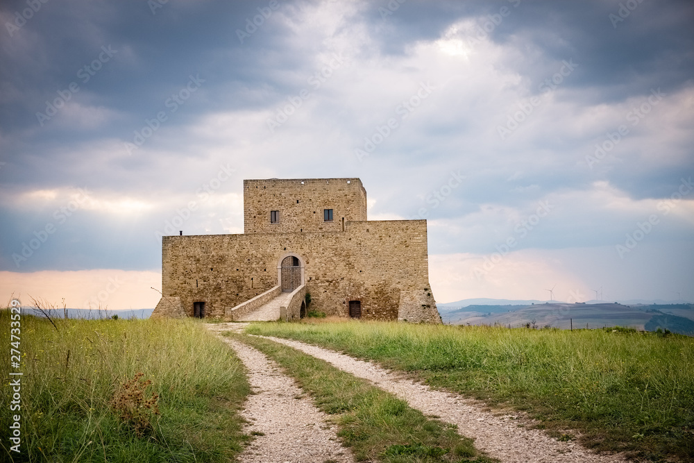 Wonderful view of Monteserico castle on a stormy day. Genzano di Lucania - Basilicata, Italy