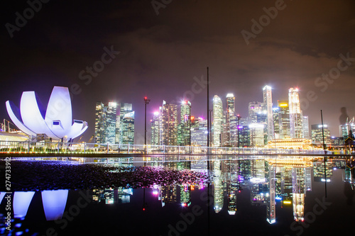 SINGAPORE, SINGAPORE - MARCH 2019: skyline of Singapore Marina Bay at night downtown core skyscrapers and the Art Science museum photo