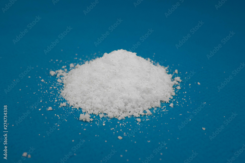 a mountain of white powder on a blue background a mountain of white powder on a blue background