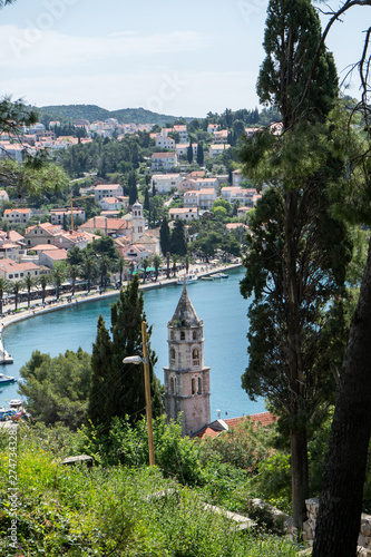 Renaissance bell tower with octagonal dome of St Nicholas church, Cavtat, Dubrovnik-Neretva County, Croatia. Coast village. Summer resort and beach photo