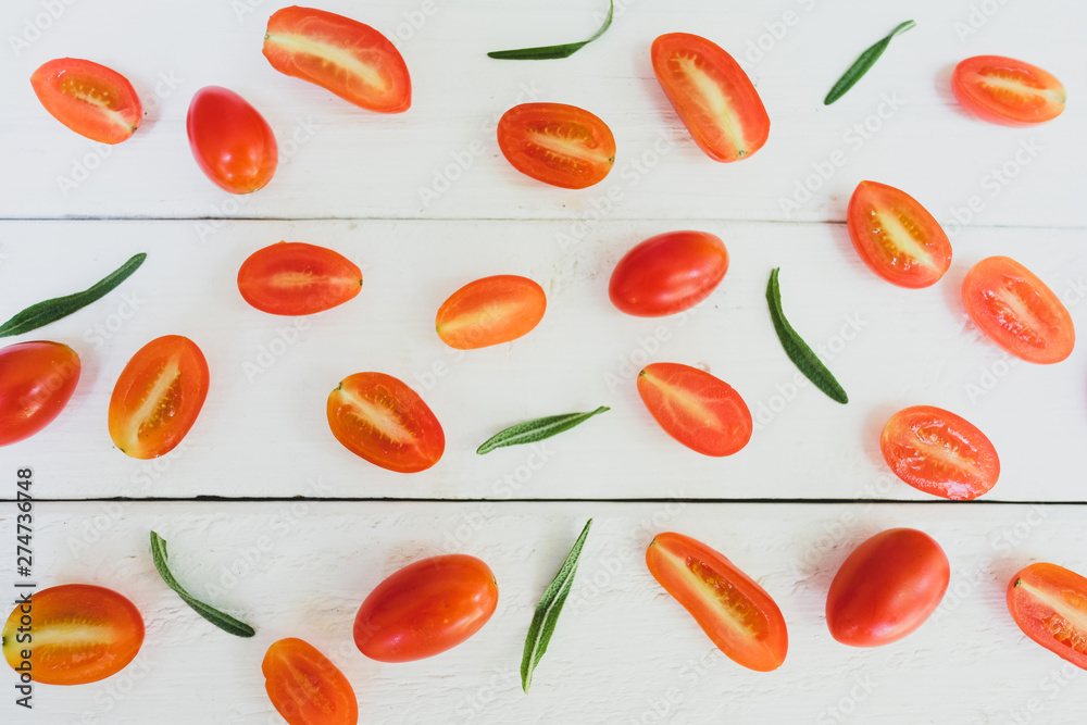 Rosemary tomatoes are placed on a white table. Rosemary tomatoes are placed on a white table.