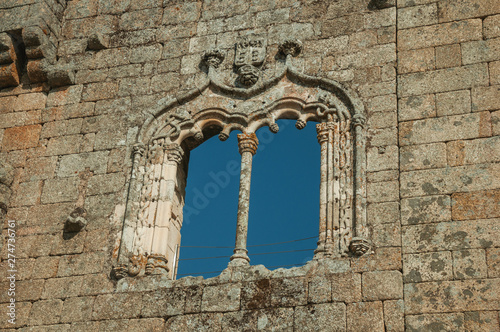 Window in gothic style on a stone wall
