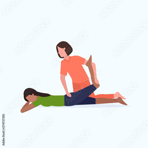 female personal trainer doing stretching exercises with african american girl fitness instructor helping woman to stretch muscles workout concept flat full length