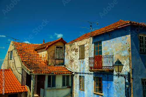 Old colorful houses with worn plaster photo