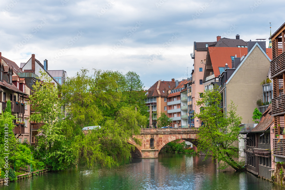 Stone bridge over the river in old Nuremberg