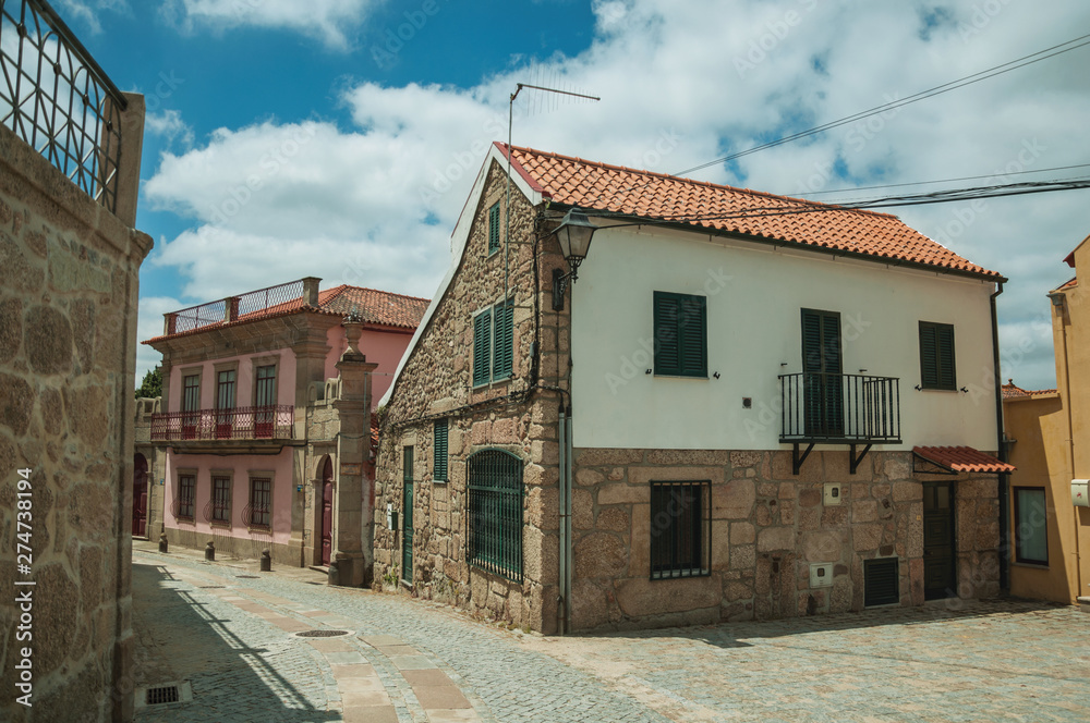 Old house with stone wall on deserted alley Old house with stone wall on deserted alley