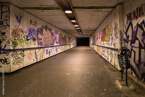 Croatia  Zagreb  June 21  the dark passage of a deserted  eerie creepy concrete indoor pathway grafted with graffiti at night