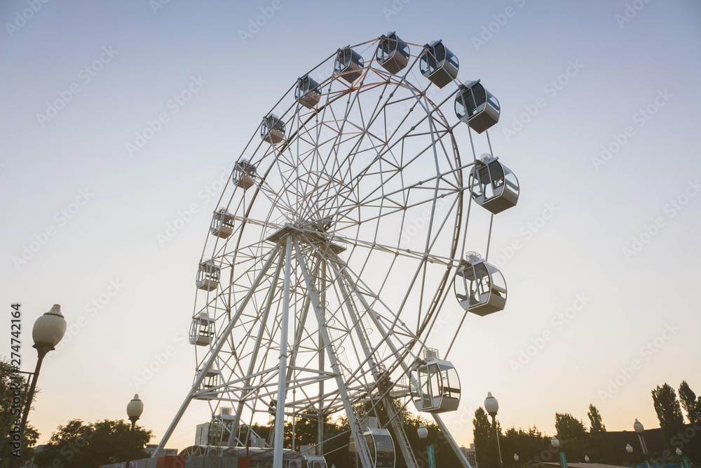 white tall ferris wheel in sight of a blue cloudless sky white tall ferris wheel in sight of a blue cloudless sky