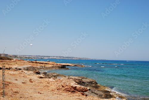 Beautiful view of the Mediterranean Sea and rocky shore under the blue sky