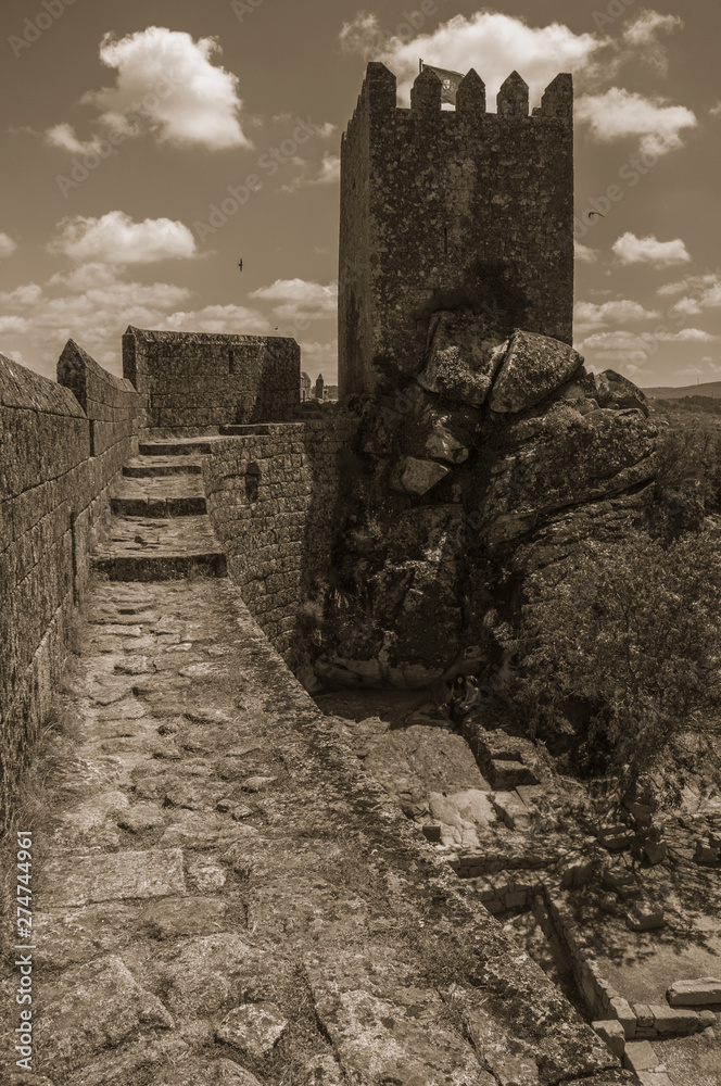 Pathway over wall and tower from keep in a castle Pathway over wall and tower from keep in a castle