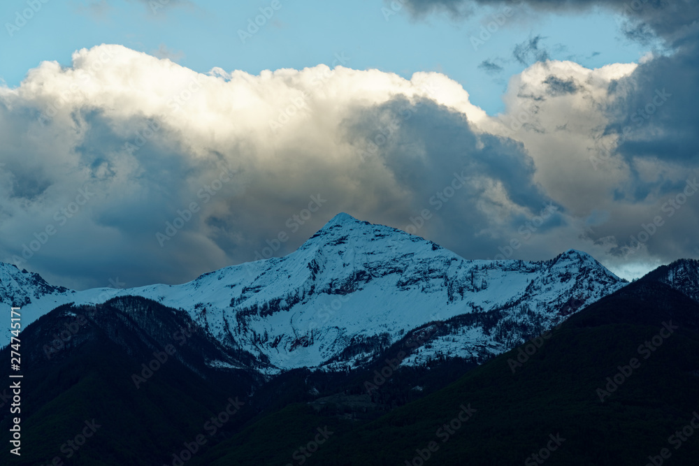 Mountains and evening clouds in Alps, Piedmont, Italy Mountains and evening clouds in Alps, Piedmont, Italy