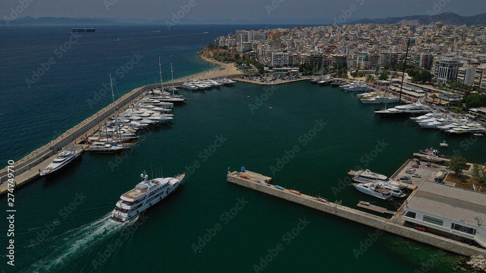 Fototapeta premium Aerial view photo of luxury yacht entering Marina Zeas, Piraeus, Attica, Greece