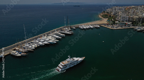 Aerial view photo of luxury yacht entering Marina Zeas, Piraeus, Attica, Greece