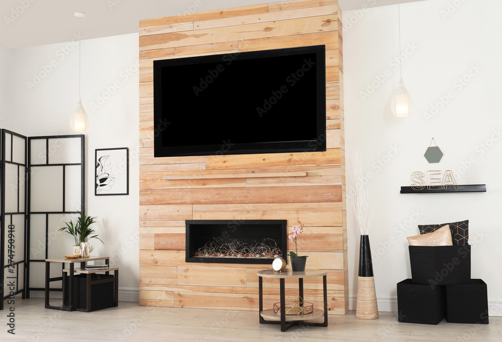 Living room interior with decorative fireplace in wooden wall Living room interior with decorative fireplace in wooden wall