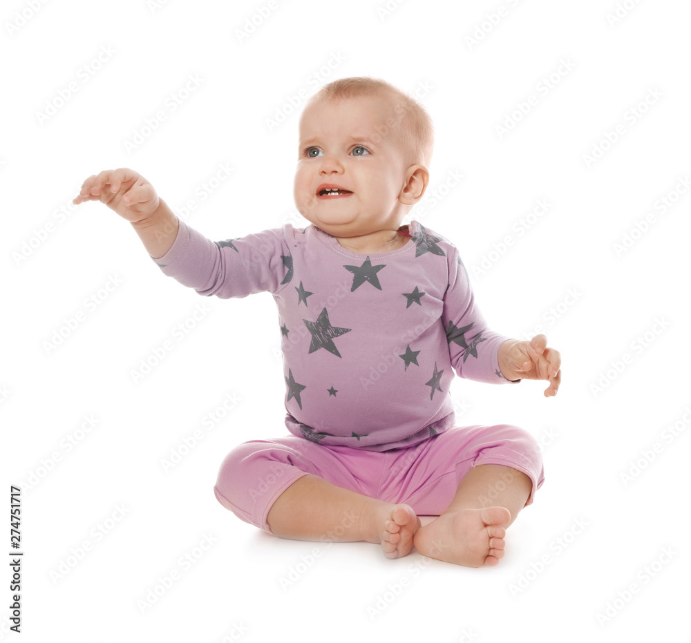 Upset baby girl sitting on white background Upset baby girl sitting on white background