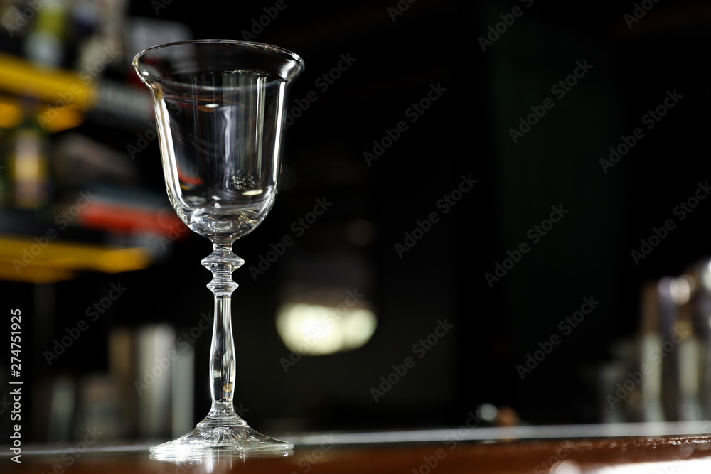 Empty clean glass on counter in bar. Space for text Empty clean glass on counter in bar. Space for text