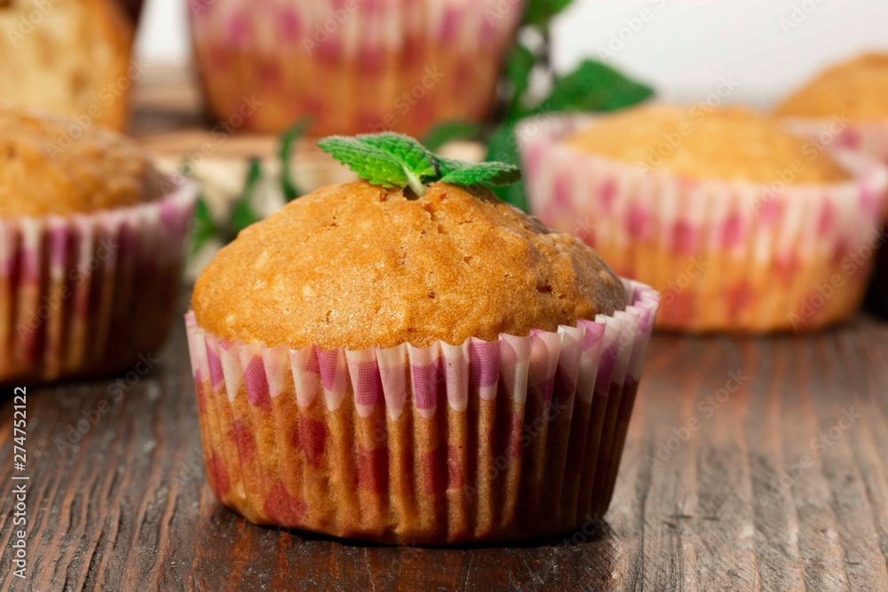 Vanilla cupcake, homemade pastry on wooden background Vanilla cupcake, homemade pastry on wooden background