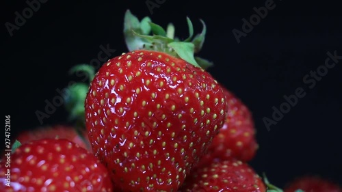 Close Up Of Red Strawberries Isolated On Black Background. photo