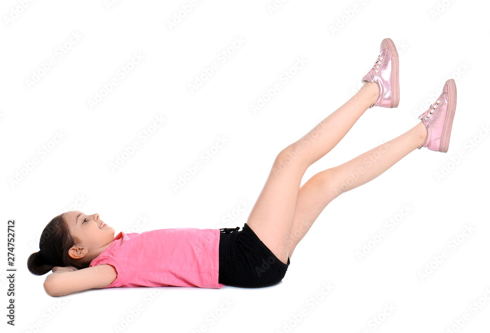 Little girl doing scissors exercise on white background Little girl doing scissors exercise on white background