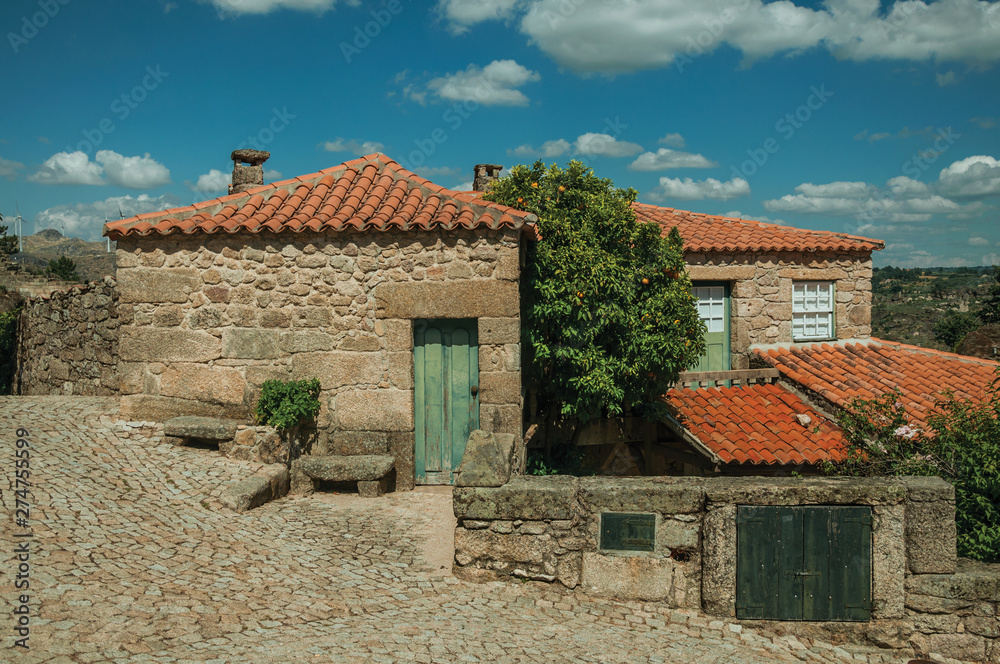 Stone houses with wooden door and deserted alley