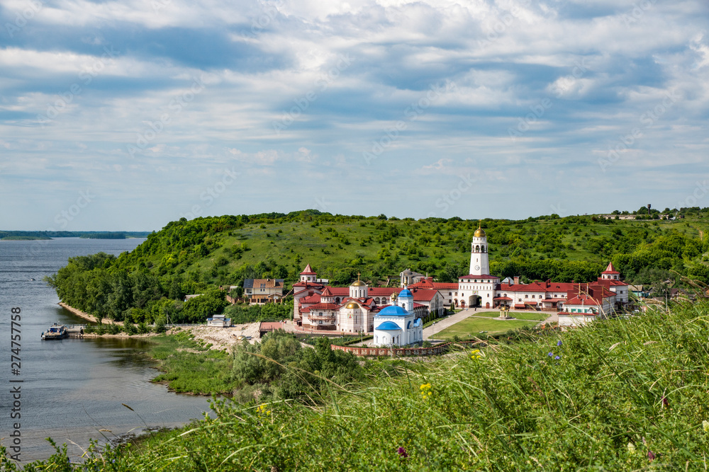 terrain, landscape, hills, distance, monastery, territory, architecture, style, buildings, Church, blue, sky, white, clouds, green,grass, trees, beauty, river, water, shore