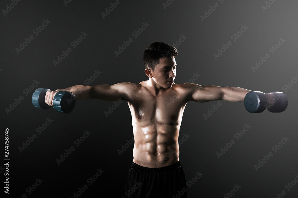 Asian man exercising his biceps with dumbbells