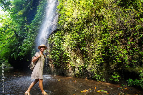 Woman near waterfal on Bali  Indonesia  