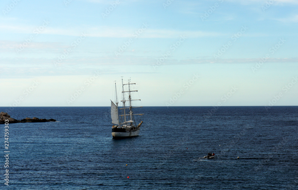 Sailing ship at anchor in the evening sea.Ibiza Island.Spain. Sailing ship at anchor in the evening sea.Ibiza Island.Spain.