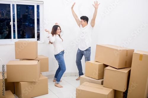 Couple expressing happy in a new apartment