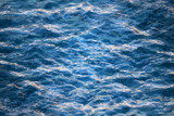 Macro photo background with transparent blue waves of sea