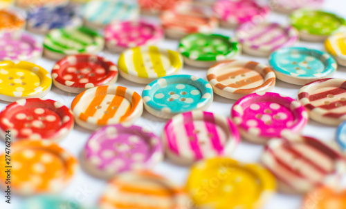 Full frame and selective focus photo of various and colorful sewing buttons