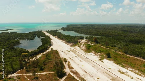 Construction of the runway of the local airport on a tropical island. Construction of a landing strip. Balabac, Palawan, Philippines. photo