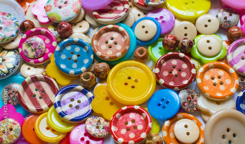 Full frame and selective focus photo of various and colorful sewing buttons photo