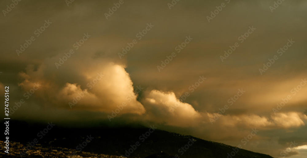 big dynamic storm clouds at sunset