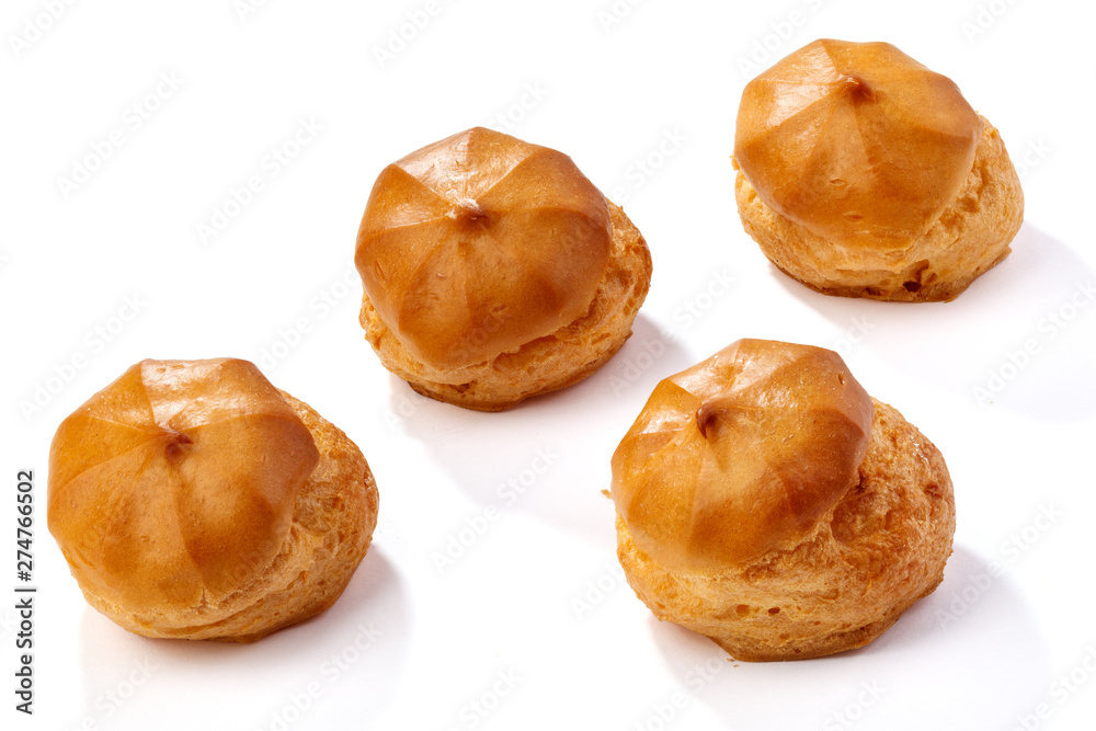 Profiterole or eclair, homemade sweets, close-up, isolated on white background. Profiterole or eclair, homemade sweets, close-up, isolated on white background.