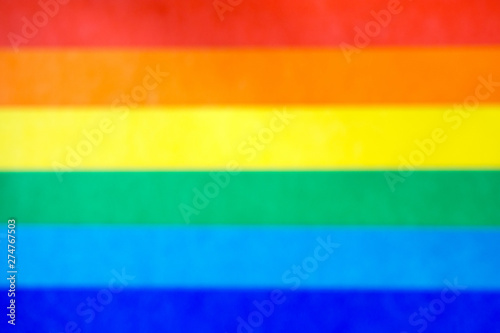 blurred background of rainbow colored stripes, LGBT flag concept