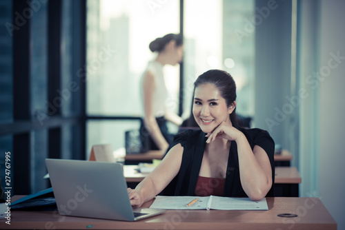 Young coworkers. Young modern colleagues in smart casual wear working while spending time in the office