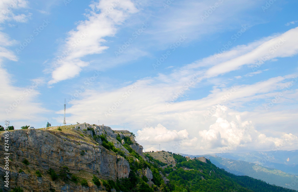 View to the mountains and blue sky with white clouds