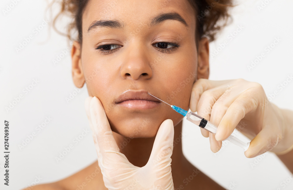 Aesthetic Cosmetology. Beautician Making Injections In Upper Lip Aesthetic Cosmetology. Beautician Making Injections In Upper Lip