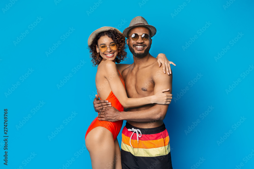 African american couple in love embracing on blue
