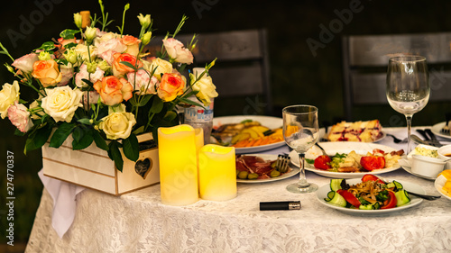 Fototapeta Naklejka Na Ścianę i Meble -  flowers and food are on the table, holiday