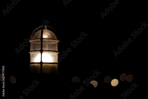 old lamp on black background © Lunsia