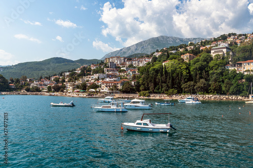 Yachts in port on the background of the Herceg Novi, Montenegro © olgavolodina