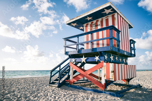 Photography Classic red, white, and blue American flag themed lifeguard tower, now retired,