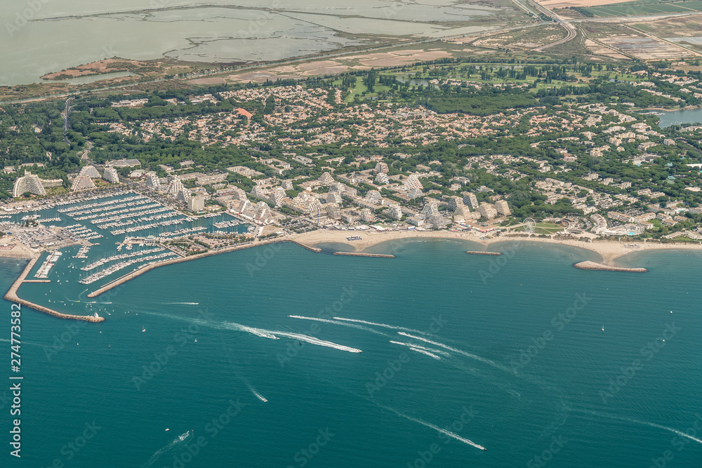 Aerial View of french coastline around city La Grande-Motte during sunny day