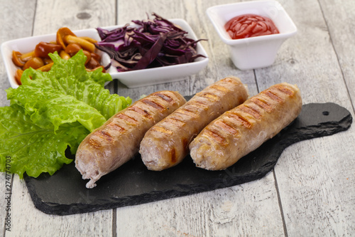 Grilled sausages served mushrooms and cabbage