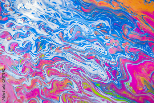 Abstract colorful painting background made in fluid art technique. Trendy pattern.